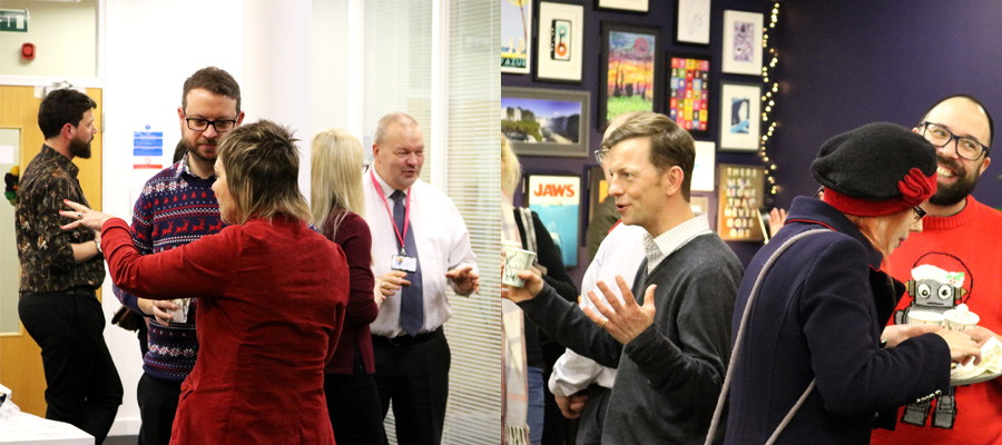 People laughing and standing around talking