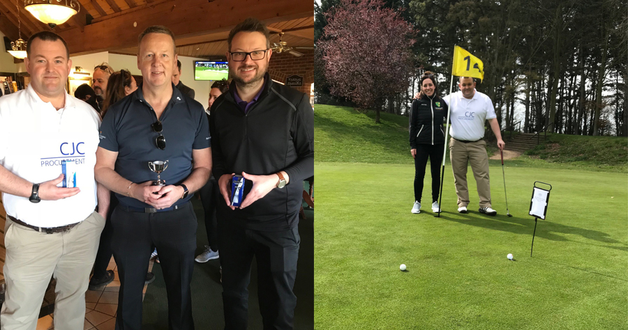 People standing with a trophy 