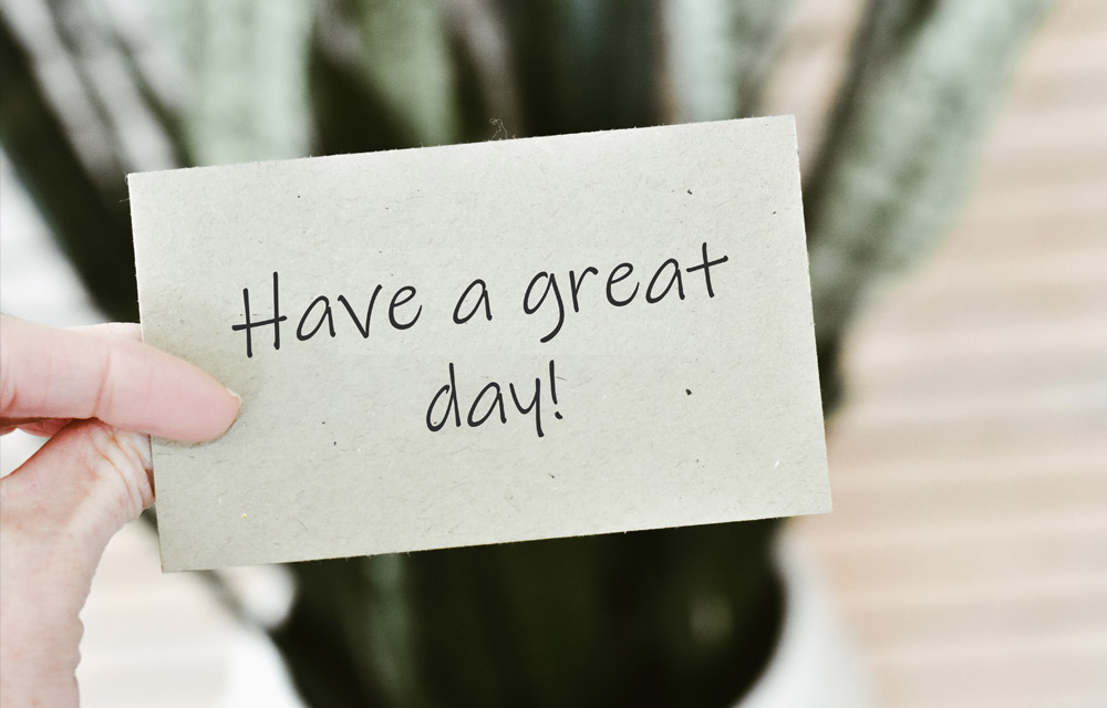 Hand holding a handwritten note