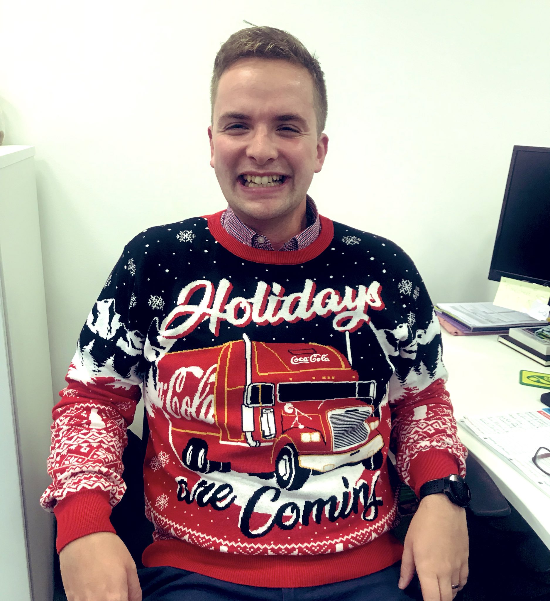 Alex wearing a Christmas jumper