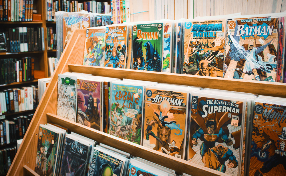 Selection of comic books in a magazine rack